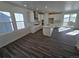 Spacious open kitchen with white cabinets, stainless appliances, and a large island with a sink at 8820 Whiteclover St, Littleton, CO 80125