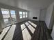 Bright and airy living room featuring a modern electric fireplace and sliding glass doors to a patio at 8820 Whiteclover St, Littleton, CO 80125