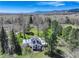 Aerial view of the property showcasing the home, surrounding landscape, and solar panels at 9445 Lykins Pl, Longmont, CO 80503