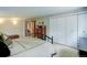 Bedroom with an array of storage, carpet and a view into the hallway at 9445 Lykins Pl, Longmont, CO 80503