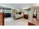 Comfortable bedroom with neutral tones, soft carpet, and dresser at 9445 Lykins Pl, Longmont, CO 80503