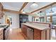 Charming kitchen featuring exposed wood beams, a tiled counter top, and stainless steel appliances at 9445 Lykins Pl, Longmont, CO 80503