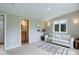 Cozy living room with ensuite bath, a comfortable sofa, and ample natural light at 9445 Lykins Pl, Longmont, CO 80503