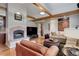 Comfortable living room with a fireplace, wood floors, and stylish decor at 9445 Lykins Pl, Longmont, CO 80503