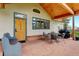 Inviting outdoor patio with stone flooring, comfortable seating, and a grill at 9445 Lykins Pl, Longmont, CO 80503