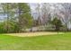 Outdoors sand volleyball court with net and surrounding trees, perfect for recreation at 9445 Lykins Pl, Longmont, CO 80503