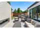 Stylish backyard patio with outdoor fireplace, built-in grill, and comfortable seating at 2564 S Carey Way, Denver, CO 80222