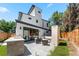Contemporary backyard featuring outdoor kitchen, modern patio furniture, and a well-maintained lawn at 2564 S Carey Way, Denver, CO 80222