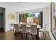 Bright dining area with backyard view, featuring a wooden table and chairs at 2564 S Carey Way, Denver, CO 80222
