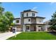 Modern two-story home with a well-manicured lawn and contemporary design elements at 2564 S Carey Way, Denver, CO 80222