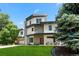 Eye-catching two-story home with a modern design and lush green front yard at 2564 S Carey Way, Denver, CO 80222