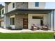 Charming front porch with seating area, modern architectural details, and well-maintained lawn at 2564 S Carey Way, Denver, CO 80222