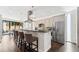 Stylish kitchen featuring stainless steel appliances, breakfast bar, and modern pendant lighting at 2564 S Carey Way, Denver, CO 80222