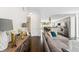 Cozy living room with modern decor, leading to the bright kitchen with bar seating at 2564 S Carey Way, Denver, CO 80222