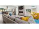 Open-concept living room with modern decor, fireplace, and seamless flow to the kitchen at 2564 S Carey Way, Denver, CO 80222