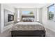 Spacious main bedroom featuring a modern fireplace, neutral tones, and a large window offering natural light at 2564 S Carey Way, Denver, CO 80222
