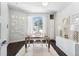 Bright home office with large window, stylish decor, and hardwood floors at 2564 S Carey Way, Denver, CO 80222