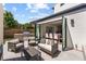 Inviting outdoor patio with comfortable seating and a built-in grill for entertaining at 2564 S Carey Way, Denver, CO 80222