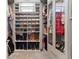 Well-organized walk-in closet with custom shelving for shoes and hanging clothes at 2564 S Carey Way, Denver, CO 80222