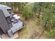 Aerial view of backyard with spacious deck and outdoor seating, perfect for entertaining guests at 1423 Belford Ct, Evergreen, CO 80439
