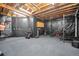 Basement gym space with blacked-out walls and workout equipment at 1423 Belford Ct, Evergreen, CO 80439
