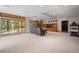 Spacious basement featuring a large sliding glass door for outdoor access and natural light at 1423 Belford Ct, Evergreen, CO 80439