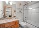 Bathroom with granite countertop vanity and updated shower at 1423 Belford Ct, Evergreen, CO 80439