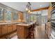 Spacious kitchen featuring wooden cabinets, granite countertops, an island, and stainless steel appliances at 1423 Belford Ct, Evergreen, CO 80439