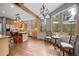 Open kitchen featuring wooden cabinets, granite countertops, an island, and a view of the backyard at 1423 Belford Ct, Evergreen, CO 80439