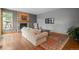 Cozy living room with a brick fireplace, hardwood floors, and ample natural light at 1423 Belford Ct, Evergreen, CO 80439