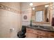 Powder room featuring decorative tiling and a black toilet at 1423 Belford Ct, Evergreen, CO 80439