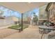 Backyard with an outdoor seating area, including a table with chairs and a small garden at 14867 E Harvard Ave, Aurora, CO 80014