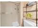Modern bathroom showcasing a glass-enclosed shower and practical shelving for a clean and organized space at 14867 E Harvard Ave, Aurora, CO 80014