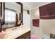 Bathroom featuring a dark vanity, an oval sink, and a shower with glass doors at 14867 E Harvard Ave, Aurora, CO 80014