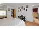 Bright bedroom featuring light wood floors and ample closet space and ensuite bathroom at 14867 E Harvard Ave, Aurora, CO 80014