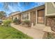 Charming single Gathering home front door featuring brick exterior, well kept yard and mature shrubbery at 14867 E Harvard Ave, Aurora, CO 80014