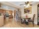Open-concept kitchen featuring stainless steel appliances and dining area at 14867 E Harvard Ave, Aurora, CO 80014