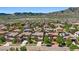 Aerial view of a neighborhood, mountains, well manicured lawns, and a prime location at 2263 S Loveland St, Lakewood, CO 80228