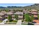 Lovely aerial view of a two-story home in a suburban neighborhood with mountain views and mature trees at 2263 S Loveland St, Lakewood, CO 80228