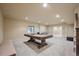 Finished basement featuring a pool table, neutral carpet and lighting at 2263 S Loveland St, Lakewood, CO 80228