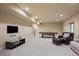 Finished basement with entertainment area, pool table, seating, and a TV at 2263 S Loveland St, Lakewood, CO 80228