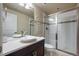 Bathroom featuring a glass enclosed shower, tile, vanity, and modern fixtures at 2263 S Loveland St, Lakewood, CO 80228