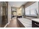 Spa-like bathroom with a large tub, glass-enclosed shower, and contemporary fixtures at 2263 S Loveland St, Lakewood, CO 80228