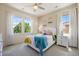 Bright bedroom with large windows, white curtains, and a ceiling fan at 2263 S Loveland St, Lakewood, CO 80228