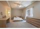 Bright bedroom with neutral walls, ceiling fan, carpet, and natural light from the window at 2263 S Loveland St, Lakewood, CO 80228