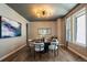 Elegant dining room featuring a modern chandelier, stylish decor, and hardwood floors at 2263 S Loveland St, Lakewood, CO 80228
