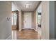 Inviting foyer with hardwood floors, a stylish light fixture, and a white front door at 2263 S Loveland St, Lakewood, CO 80228