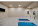 Home gym with exercise mats, mirror, and TV is ideal for fitness enthusiasts and active lifestyles at 2263 S Loveland St, Lakewood, CO 80228