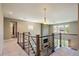 Second-floor hallway overlooking the living room with views of the fireplace and backyard at 2263 S Loveland St, Lakewood, CO 80228
