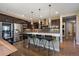 Contemporary kitchen featuring a large island with seating, pendant lighting, and stainless steel appliances at 2263 S Loveland St, Lakewood, CO 80228